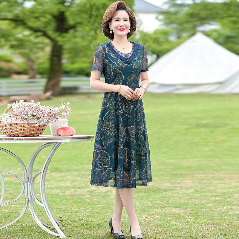 中年のお母さんの婦人服の半袖のワンピースの夏服の洋風の百塔の気質の大きいサイズの新型はやせている中高年のスカートを現します。|undefined