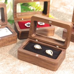 新しい長方形の黒い胡桃の実木の対戒箱の結婚式の指輪のアクセサリーの収納箱のアクセサリーのピアスの箱の窓のギフトの箱