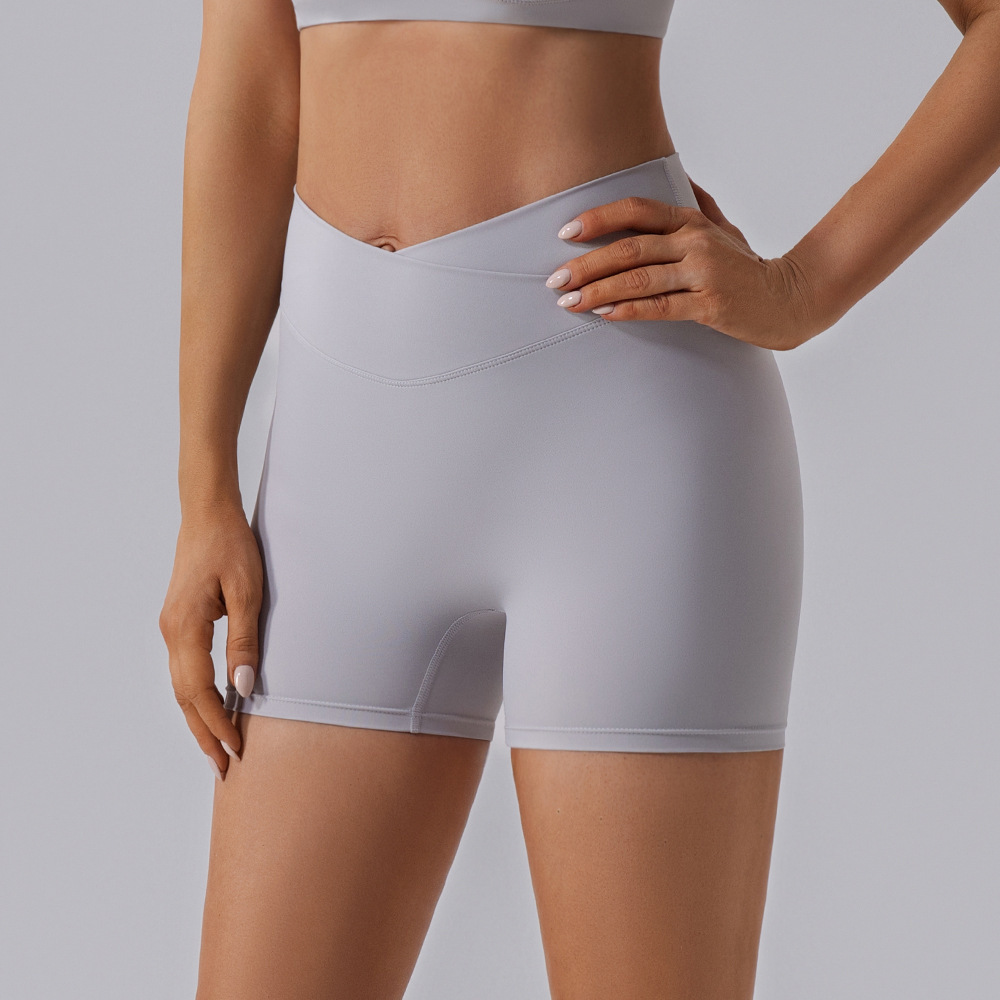 Procesamiento personalizado europeo y americano elástico mel桃 hips fitness pantalones cortos desnudos secado rápido sexy para elevar las hips de yoga de mujer panty
