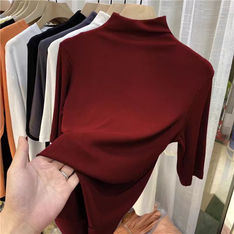 秋冬の小さい立襟の半袖のtシャツの女性の早秋の新型の韓国版は半高襟の5分の袖の純色の上着を身につけます。|undefined
