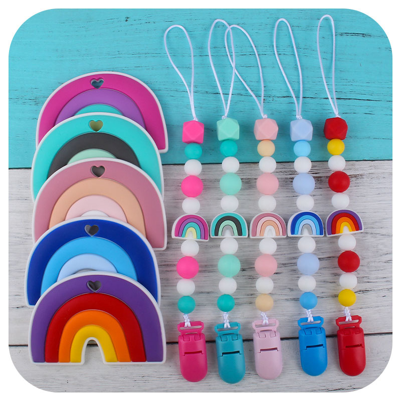 Nuevo bebé dibujos animados colorido rojo silicona teether palo pezón cadena anti-gota cadena juguete teether traje