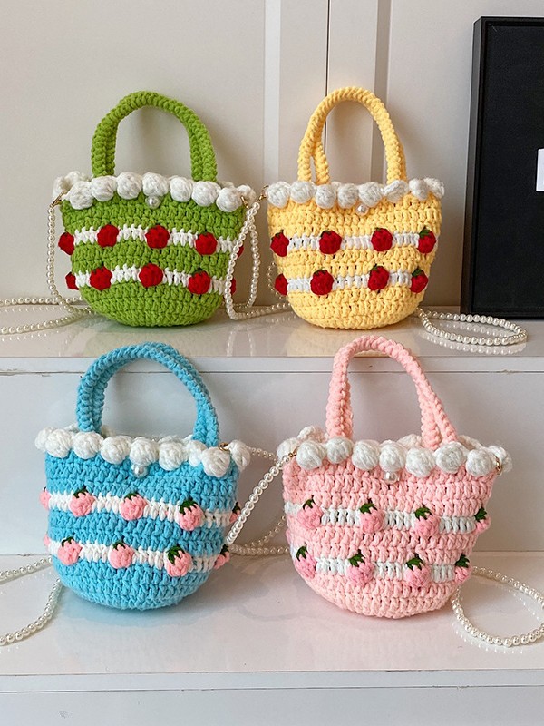 Bolso de mensajero de nicho de dopamina femenino 2025 nuevo bolso de fresa bolso tejido de vacaciones bolso de cubo bolso transfronterizo