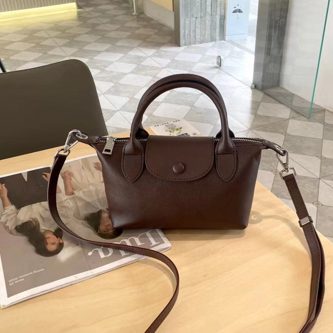 Bolsos femeninos 2024 nuevos bolsos femeninos de cuero de alta costura de moda 100 bolsos correccionales para viajeros de nicho bolsos portátiles