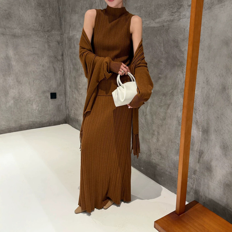 Cross-border knitted three-piece set for women, featuring a Hepburn-style fringed knitted shawl, vest, and skirt, perfect for autumn and winter, and designed for export