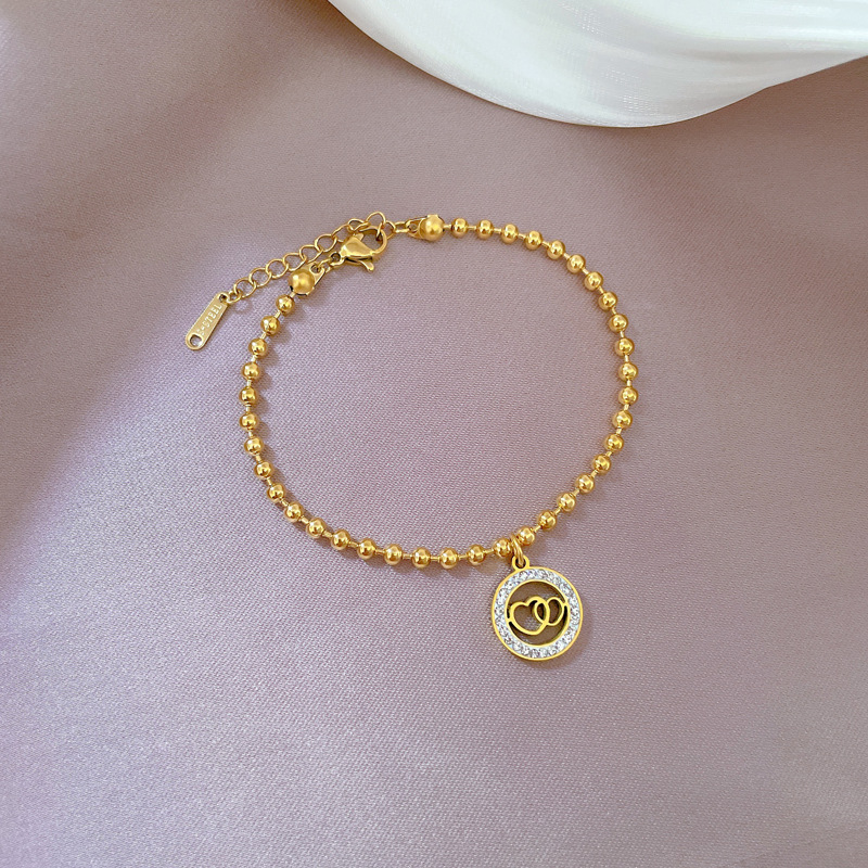 Bracciale doppio anello con perline per donna_voghion.com