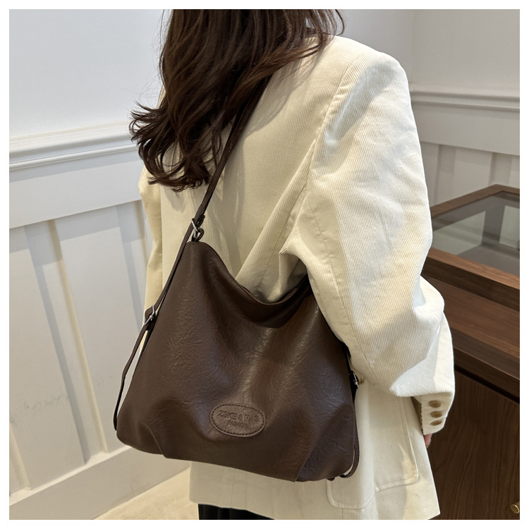 The 2024 new pleated tote bag is a large-capacity casual and fashionable backpack for women, featuring multi-functional texture and a single-shoulder crossbody bag undefined