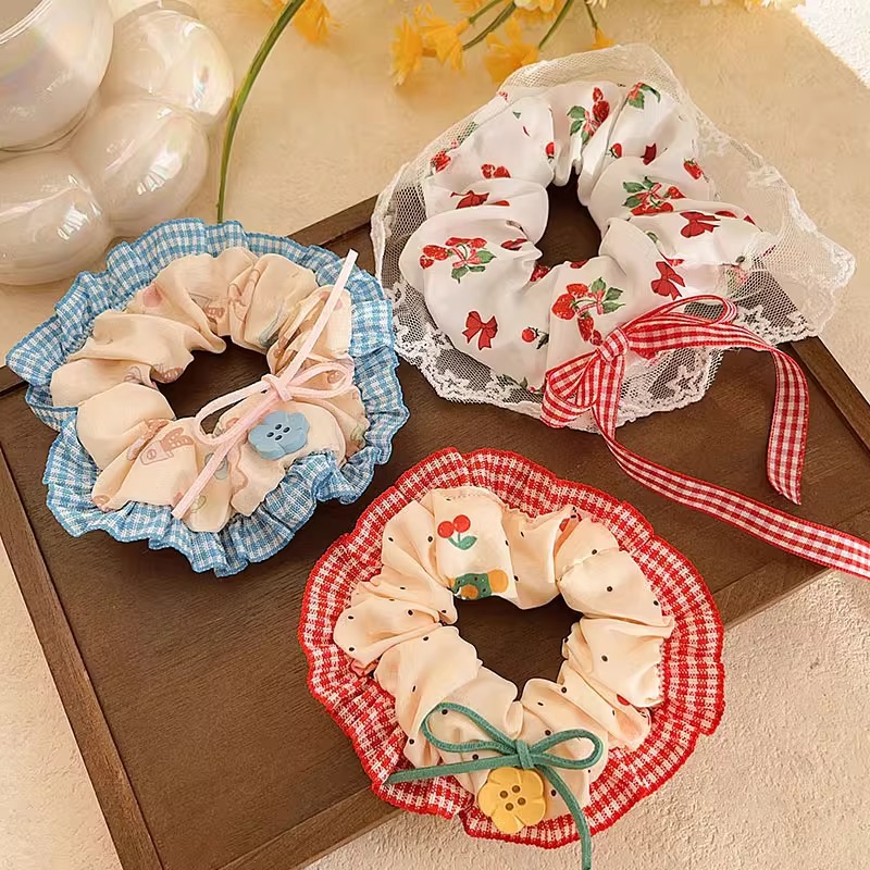 Pastoral viento intestino anillo de cabello mujer 2025 nuevo estilo de alta sensación bola de cabello cuerda de cabeza flor dulce princesa adornos de cabello cuerda