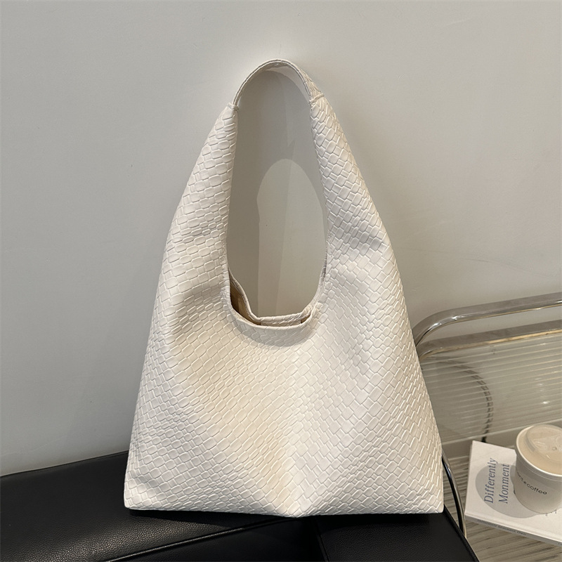 Casual diseño de gran capacidad de estilo extranjero bolso de hombro 2025 moda trenzado bolso de viaje simple retro bolso de brazo