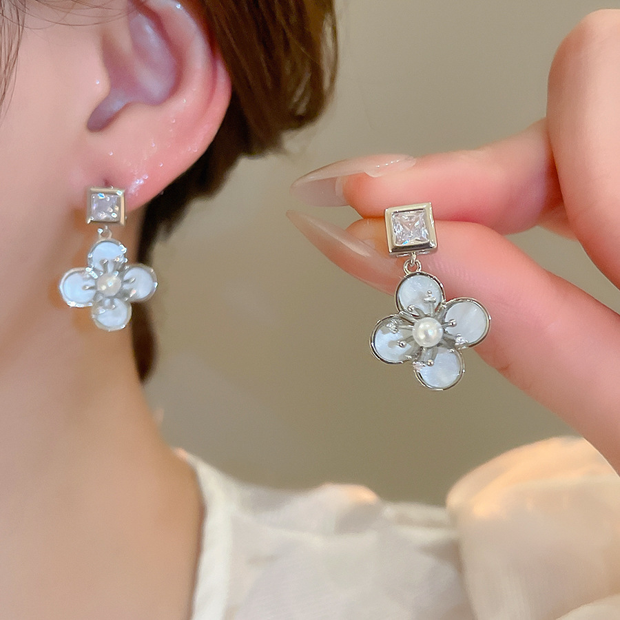 Pendientes de flor de lazo elegante de súper hada de plata Pendientes de moda de lujo ligero francés Pendientes de todo fósforo dulce de estilo literario