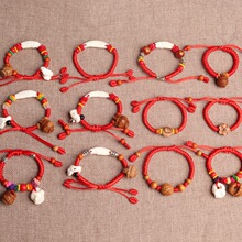 十二生肖宝宝儿童手链牙小木鱼桃核配饰手链婴儿儿童红绳工艺品