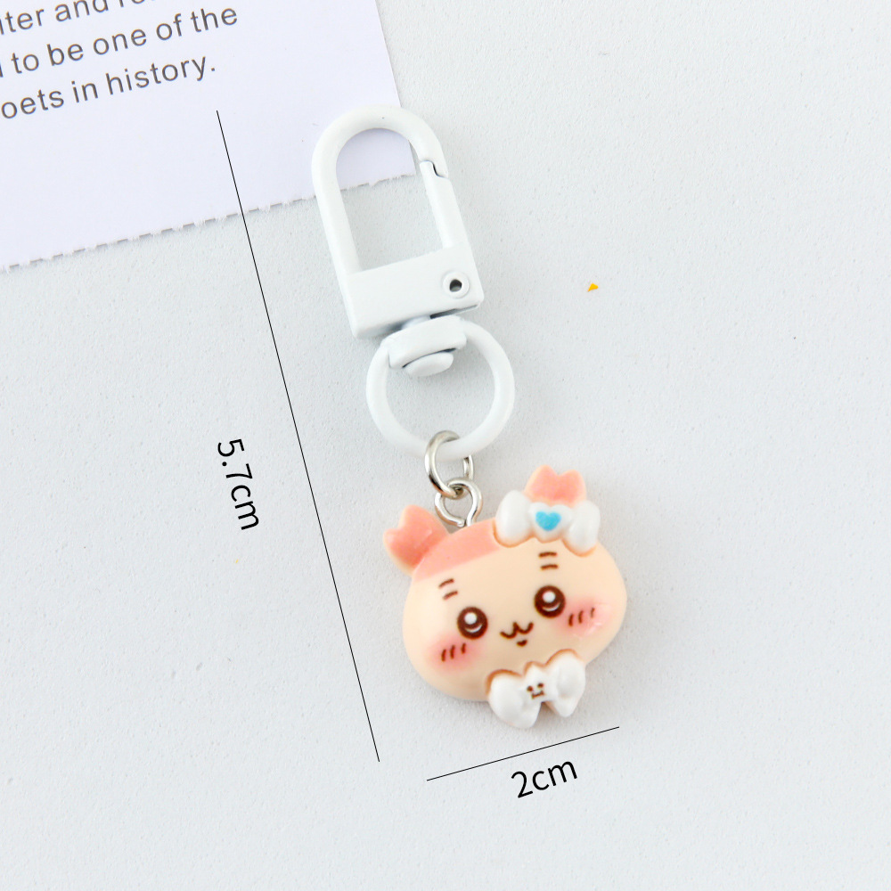 Caricatura linda corbata pequeña ocho llaveros colgantes pareja amigas bolsos colgantes de alto valor de belleza llaveros de corazón de niña