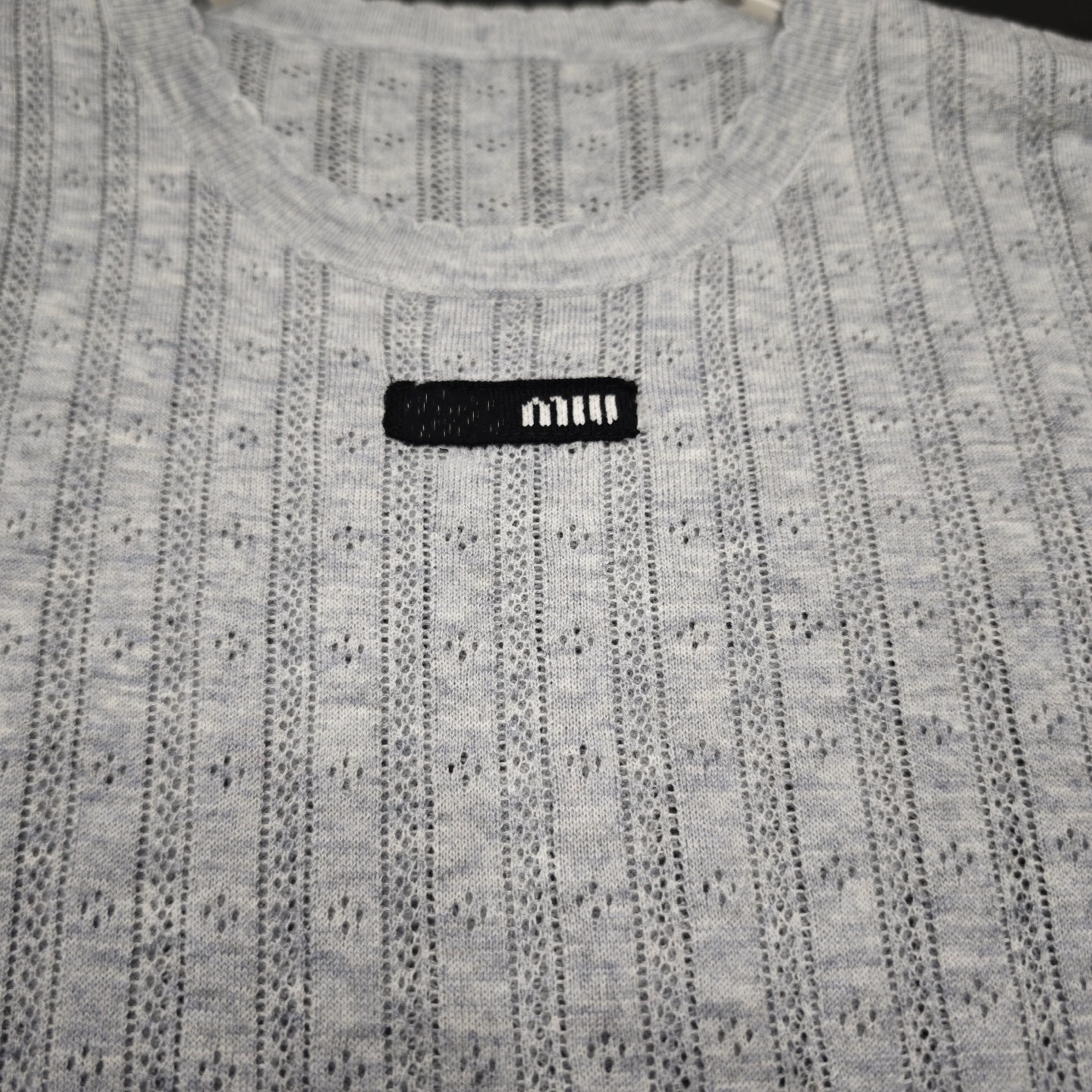 Summer knitted sweater with a round collar