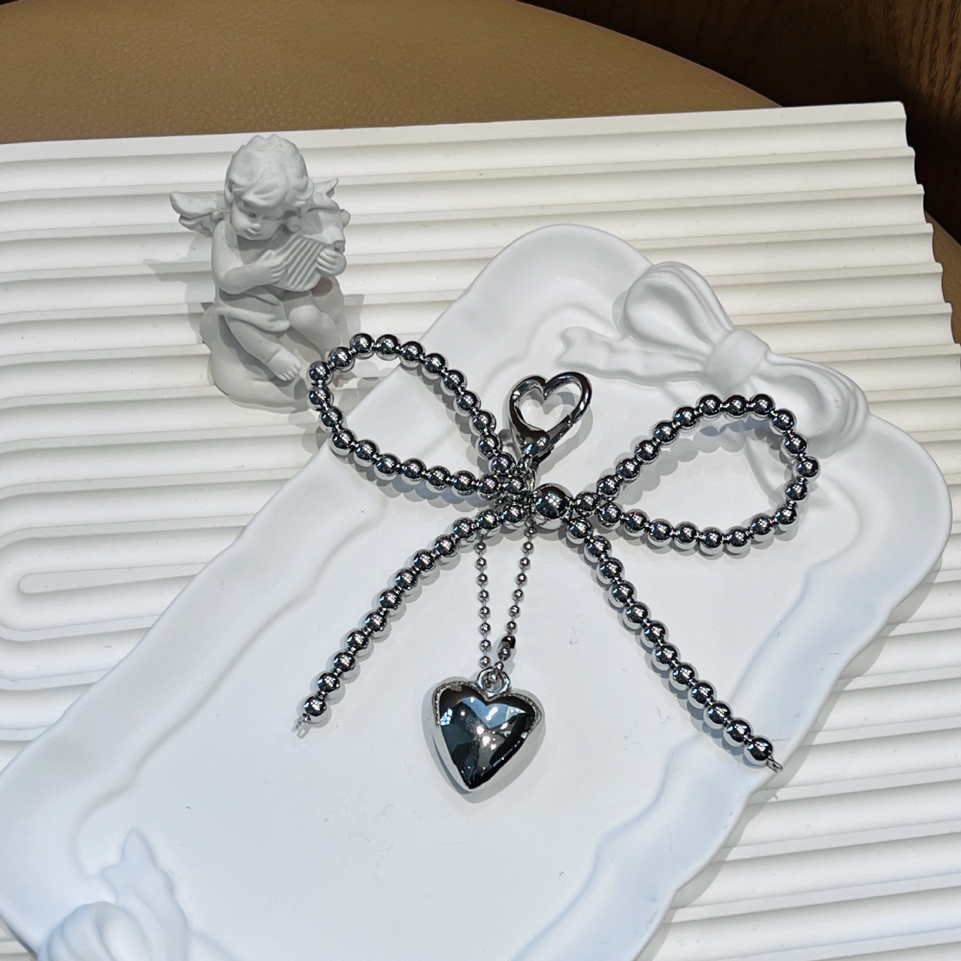 Amor botón arco bola de acero cuelga amor