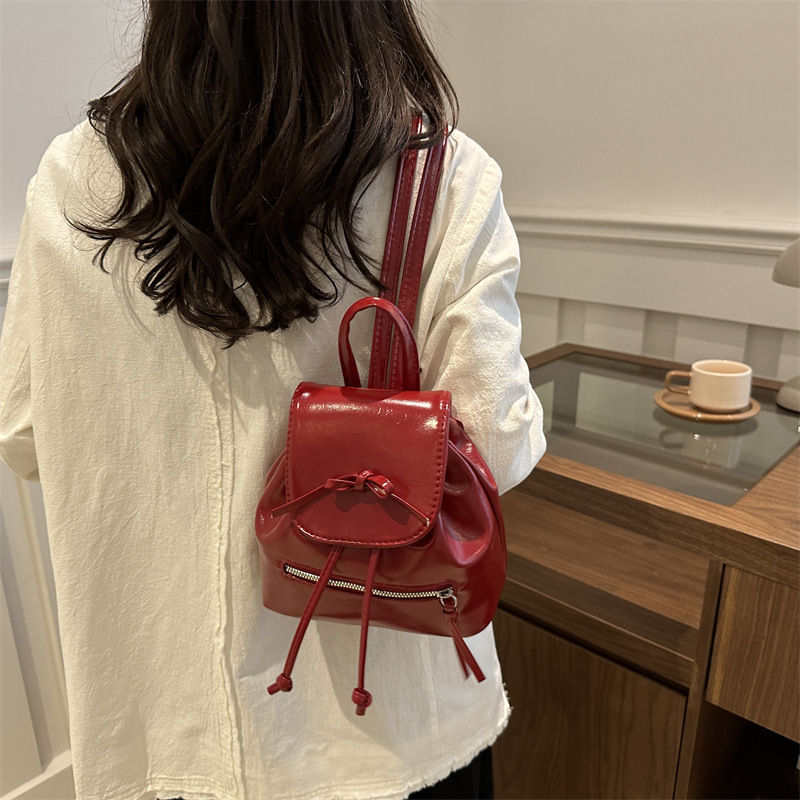 Mochila de nicho coreana para mujer, verano 2024, nueva mochila de moda, bolso de cubo portátil de un solo hombro de todo fósforo