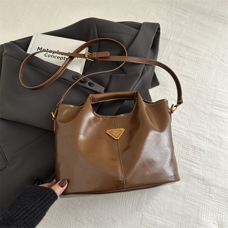 2024 alto valor retrógrado estilo de negocios Meillard bolso de cubo de mano de viaje versátil de invierno nuevo bolso de hombro