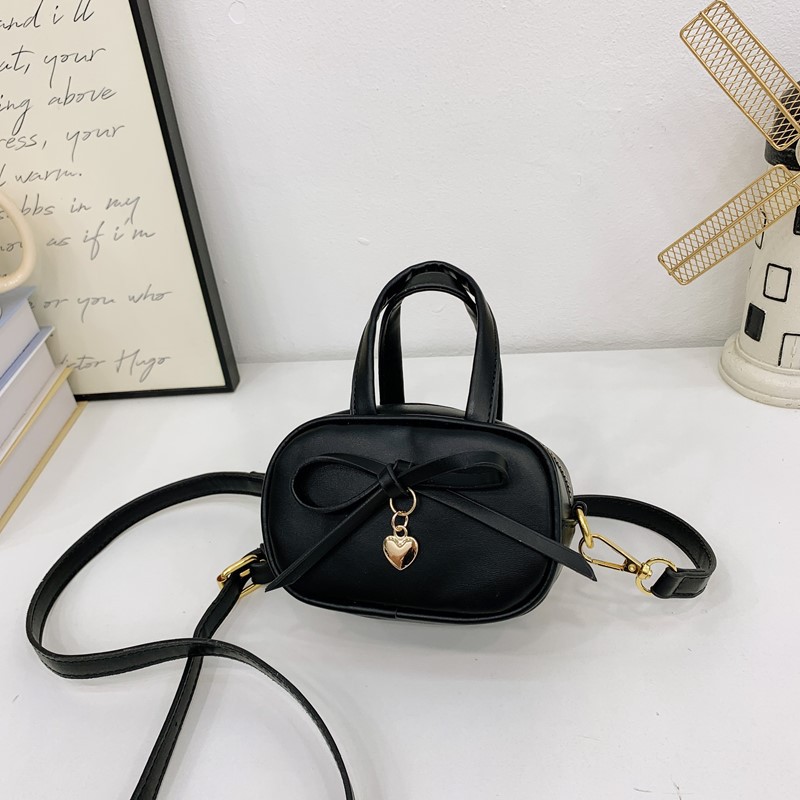 Coreano simple color sólido bolso de hombro para niños y niñas mini bolso de bebé lindo dulce bolso de arco para niños
