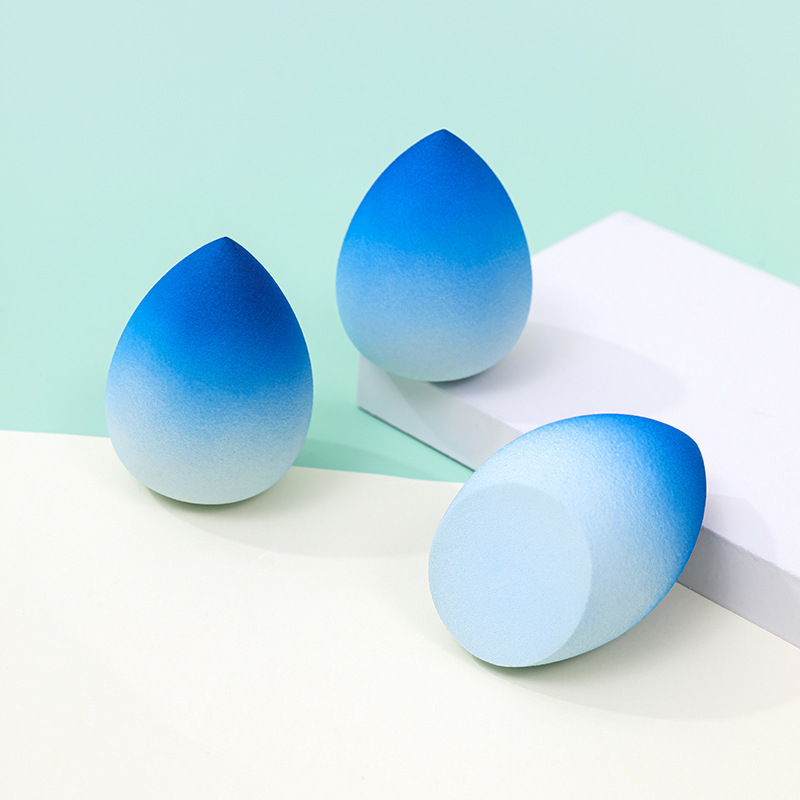 Huevo de maquillaje de belleza de color degradado personalizado de fábrica, no coma polvo, no látex, color en aerosol, maquillaje en forma de calabaza, esponja, huevo de maquillaje