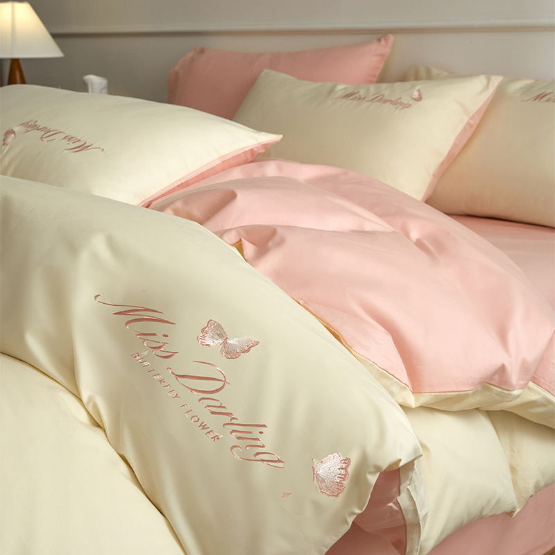 Estilo de lujo ligero 40 piezas de algodón puro traje de cuatro piezas corazón de niña bordado floral funda de edredón ropa de cama de algodón suave de alta calidad