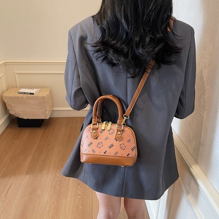 Bolso de mochila para mujeres 2025 textura fresca de alta calidad felina de moda versátil bolso coreano de viaje bolso de hombro