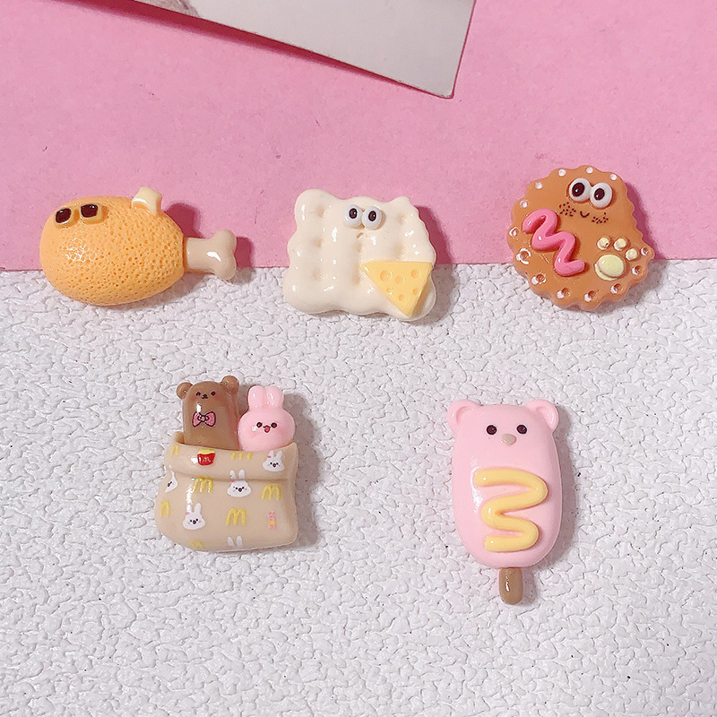 Caricatura brillante cara extraña comida DIY accesorios de resina joyas hechas a mano pinzas de pelo de casco de teléfono celular taza de agua tocado al por mayor