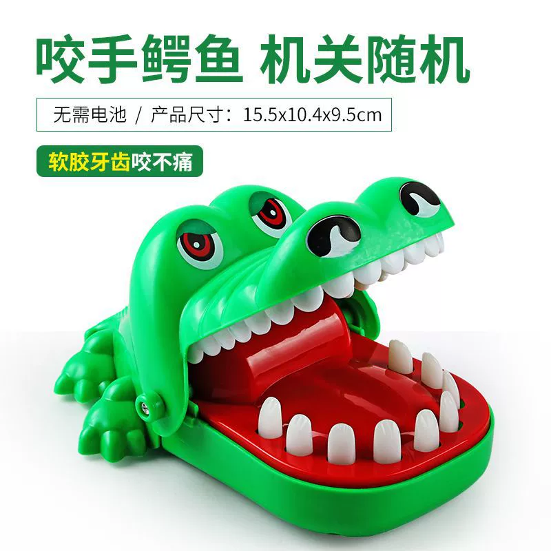 Crocodile, toy for boys, bites finger