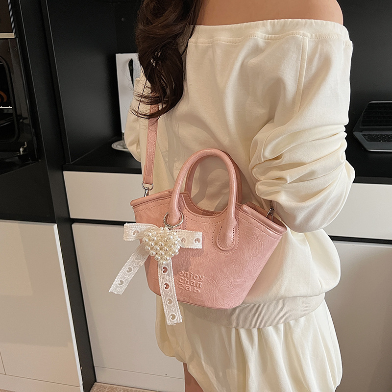 Bolso de cubo de mano de nicho de comercio exterior 2025 nuevo producto bolso de mensajero de moda casual de todo fósforo bolso de hombro de viaje de trabajo de moda