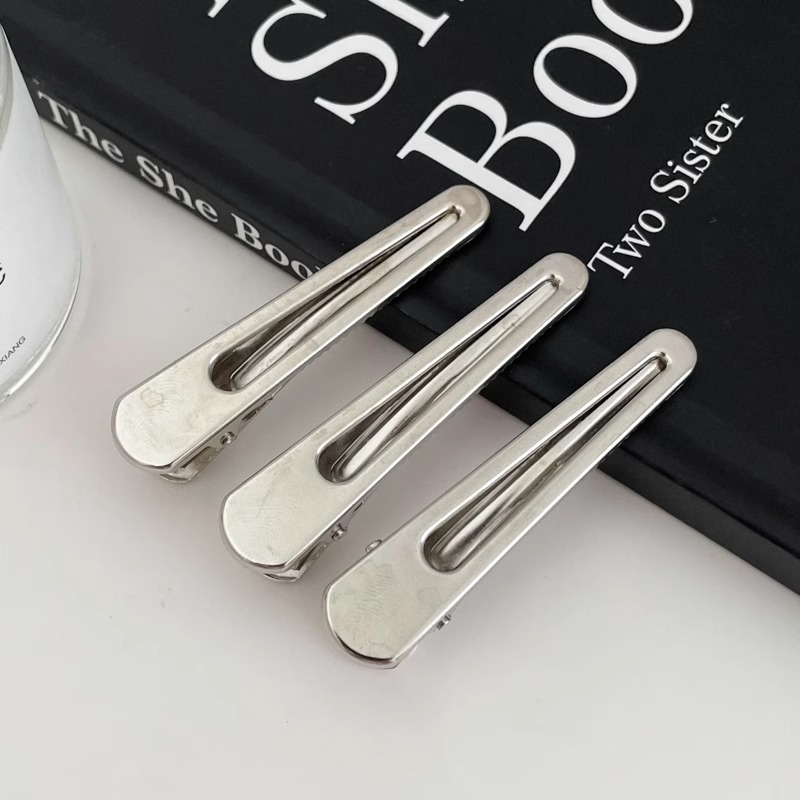 Fijación de cabello de metal fría plata en forma de clip de nariz de pato temperamento agujero estrellas clip de cabello frente lateral clip de cabello roto mujer