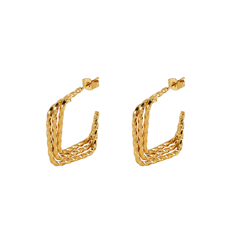 Pendientes torsos de acero inoxidable estilo americano europeo y americano Diseño de nicho de moda Pendientes de acero de titanio femenino de todo fósforo de nuevo estilo de 18K