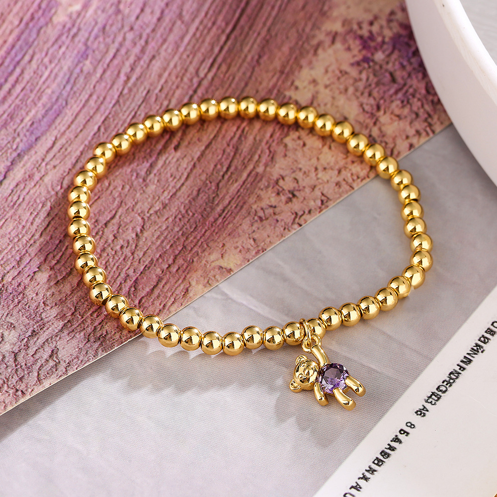 Bracciale con pendente orsetto e perline in rame e zircone donna_voghion.com