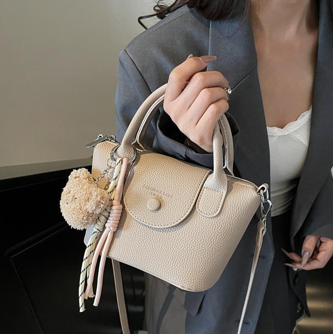 Bolsos pequeños de mano más vendidos de comercio exterior para mujer 2025 nuevo bolso cuadrado pequeño simple y todo fósforo textura casual bolso de mensajero de un solo hombro