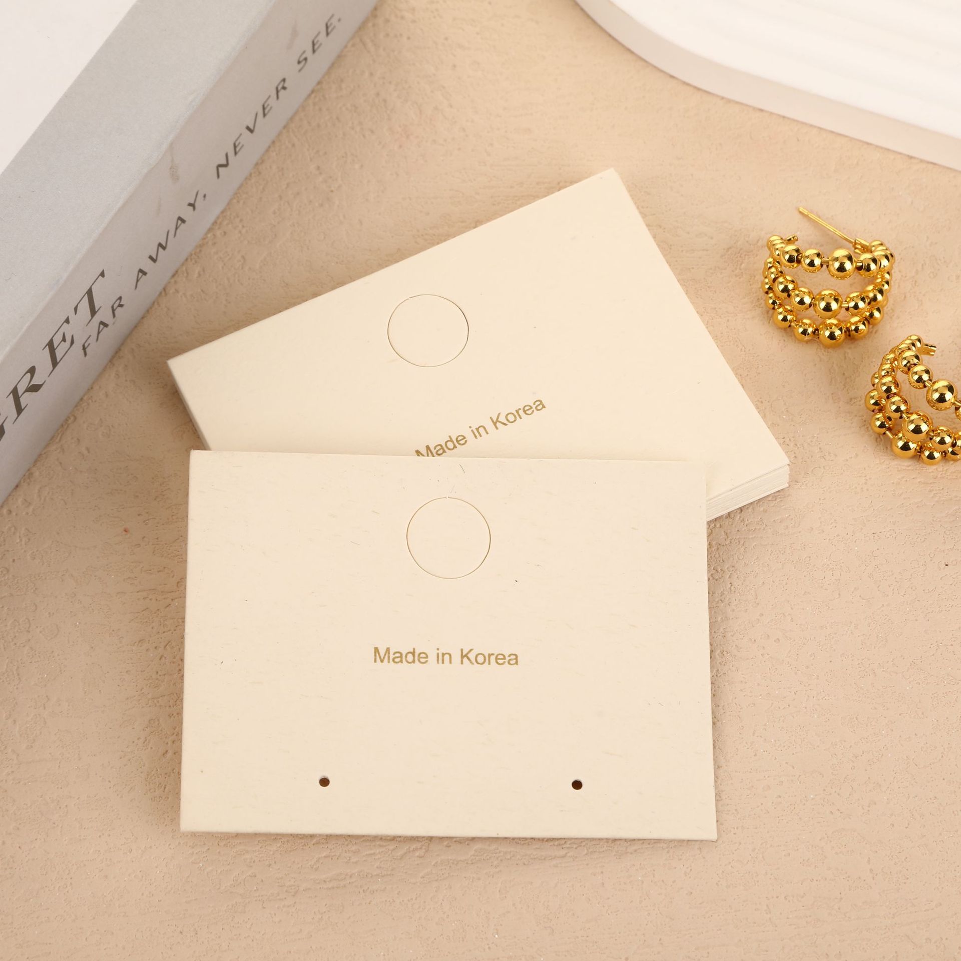 Fábrica directa de aretes explosivos joyas de embalaje tarjeta de papel de hierba tarjeta blanca en stock al por mayor