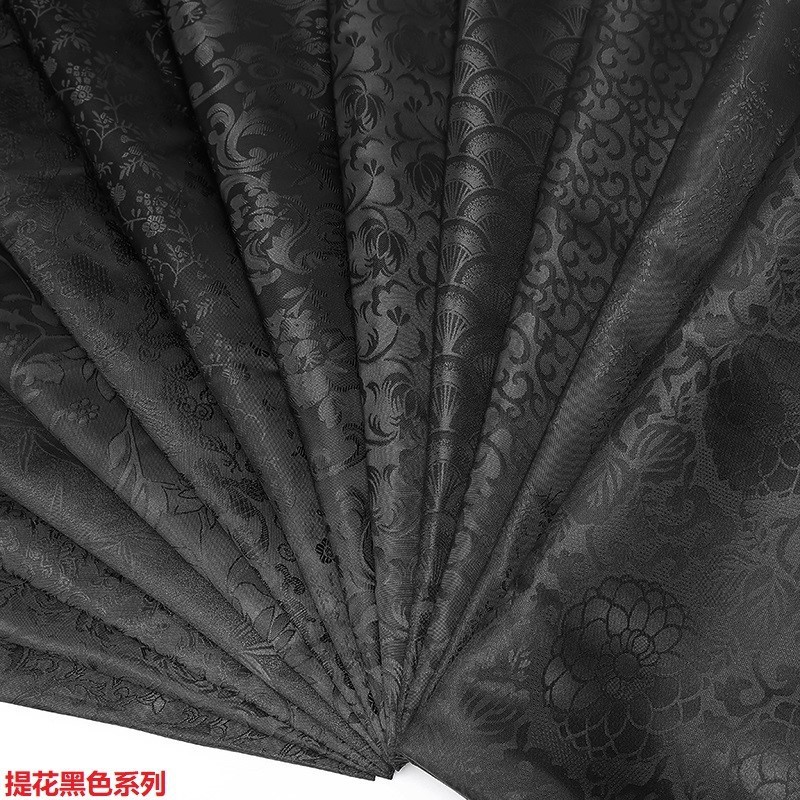 现货无弹做包里子布料暗纹娃衣服复古汉服礼服国风面料黑色提花布