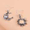 Retro asymmetrical earrings solar-powered, boho style, moonstone