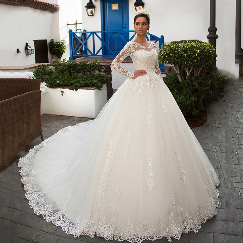 Vestido de novia de comercio exterior 2026 con cuello redondo, manga larga, encaje, estilo francés adelgazante y cola de sirena.