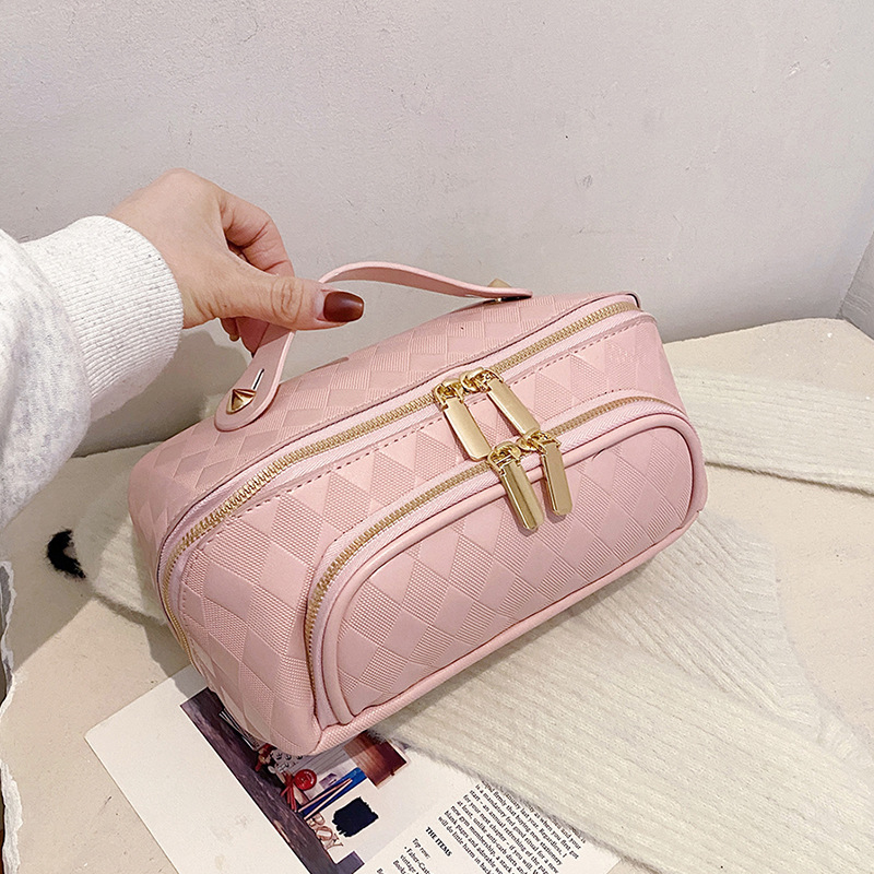 Nuevos bolsos de maquillaje transfronterizos pu-rango de nicho de moda de gran capacidad para mujeres bolsas de almacenamiento portátiles de viajes en línea bolsa de lavado roja