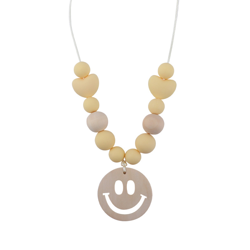 Nuevo bebé suministros smiley cara mordedor collar bebé cuentas de silicona mordida molar masticable colgante collar