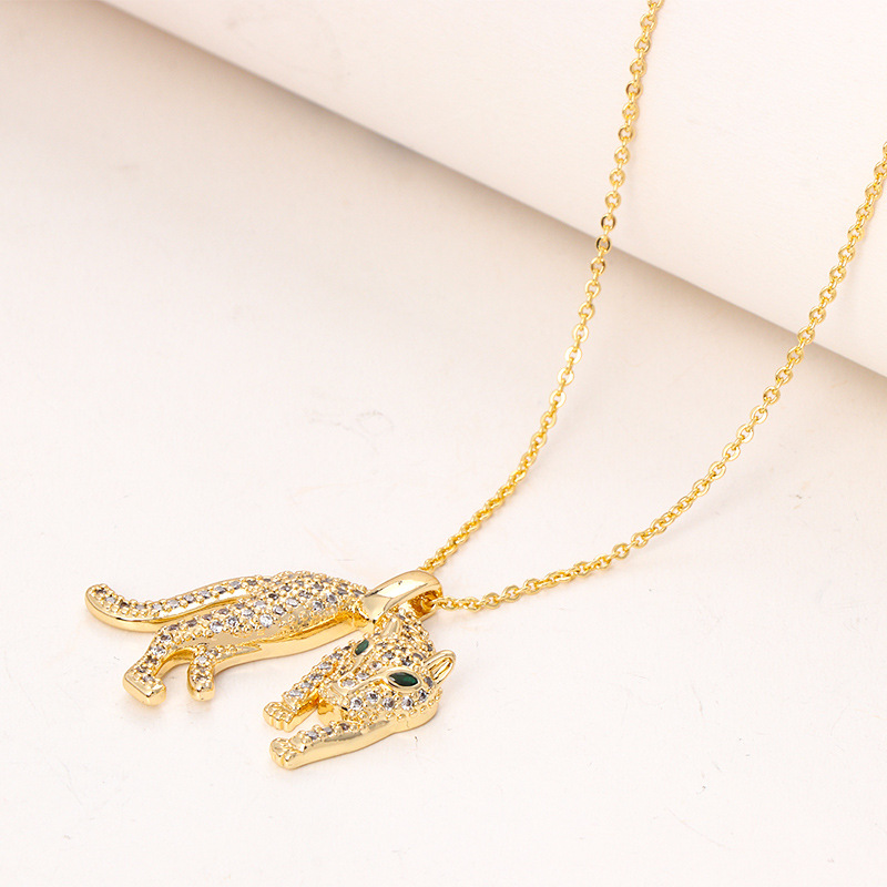Nouveau collier polyvalent personnalisé hip-hop avec pendentif léopard en zircon et diamants, plaqué cuivre, véritable or transfrontalier, style hip-hop_voghion.com