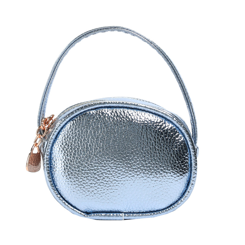 Bolso de mano de niña láser brillante simple color sólido mini bolso de cambio de bebé coreano nuevo bolso infantil transfronterizo