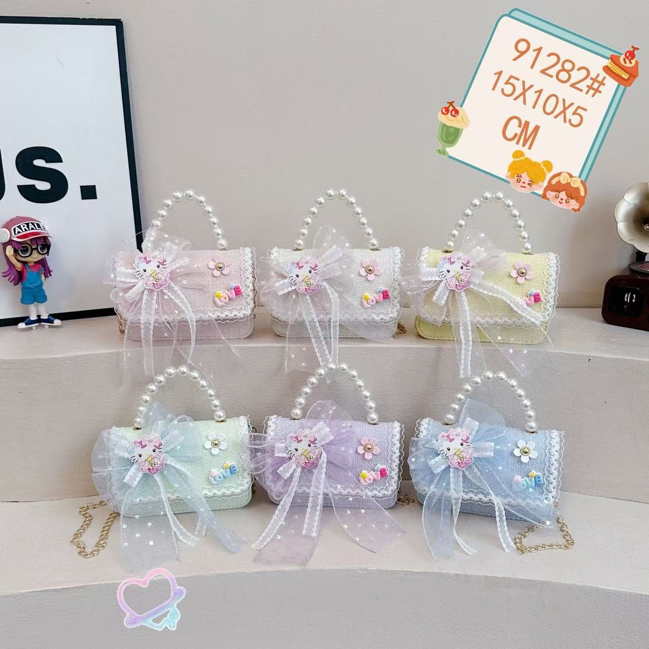 Nuevo comercio exterior pequeña fragancia niñas hombro mochila de moda perla arco bolsos de niños bolsos de cambio de dibujos animados