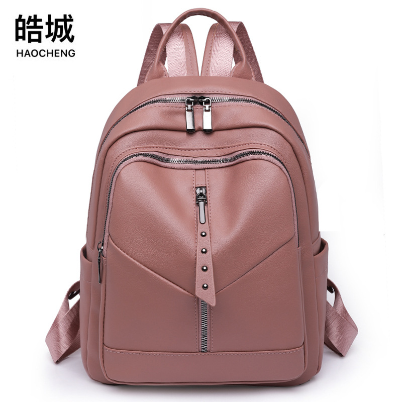 Fábrica al por mayor 2023 nueva mochila casual de cuero suave para mujer moda salvaje color sólido mochila de viaje al aire libre marea