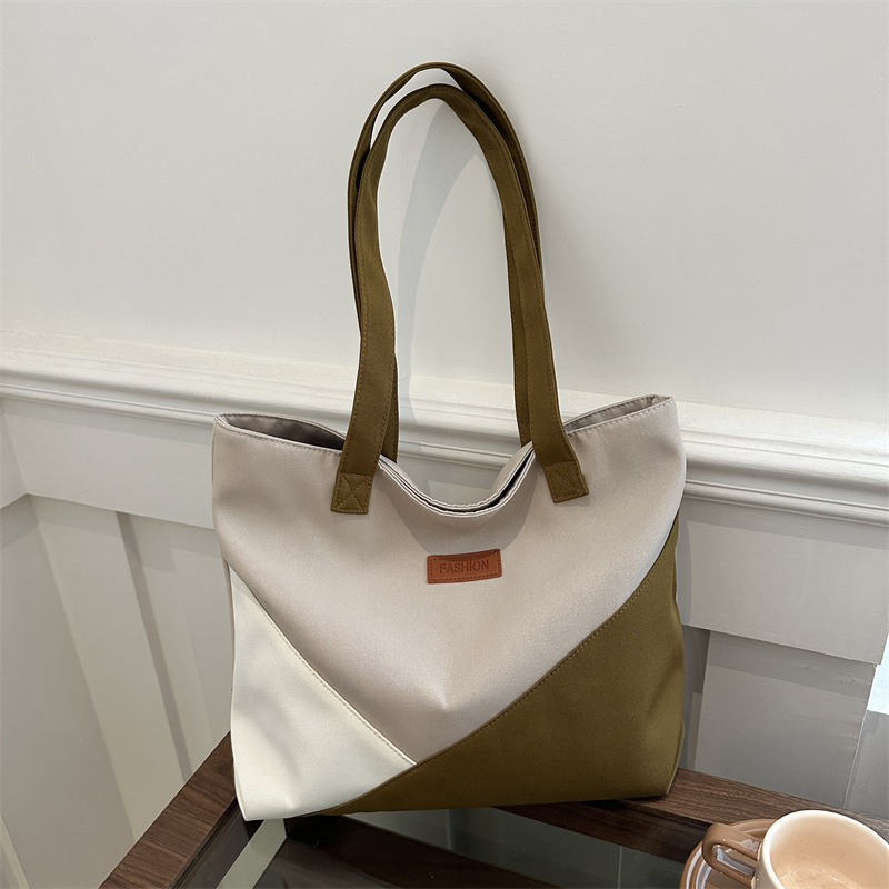 Bolsa de tela de gran capacidad para mujeres 2024 nuevo bolso de alta calidad nicho bolso de viaje bolso de hombro de moda