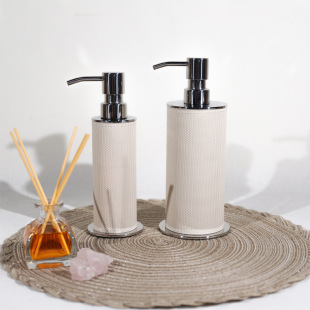 Modern light luxury stainless steel leather bathroom kit soap dispenser lotion press bottle Model Room soft package matching