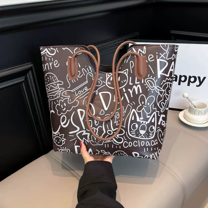 涂鸦手提托特包包女2025秋冬新款休闲单肩包大容量腋下包斜挎
