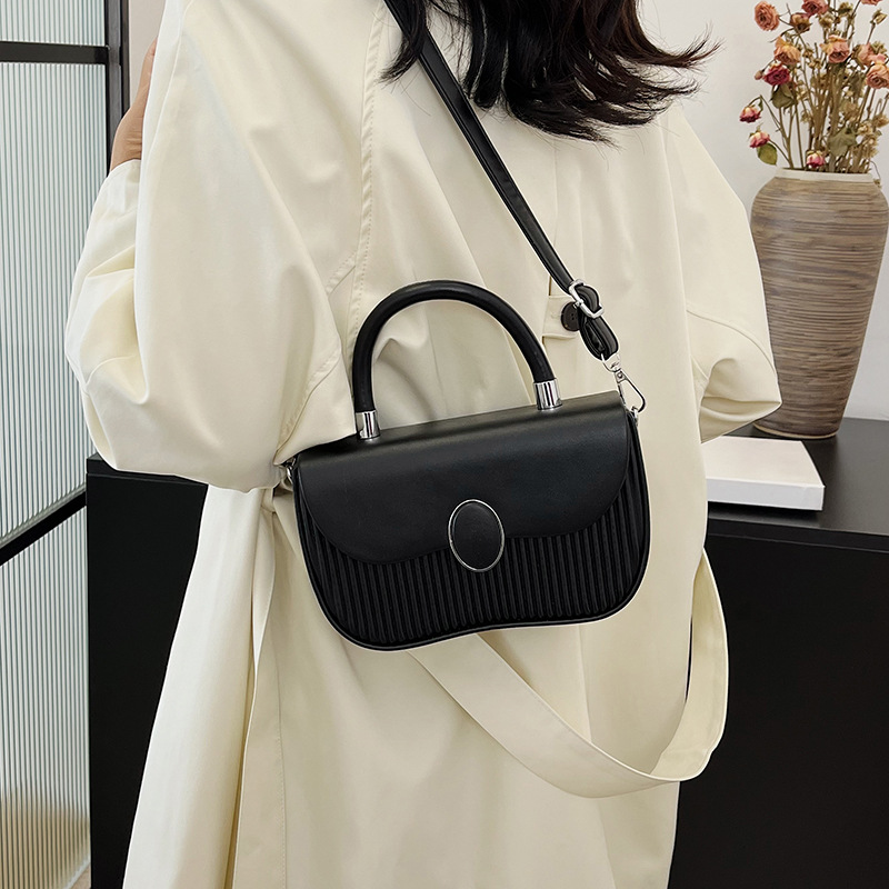 Versión coreana del bolso de nicho 2025 verano nuevo bolso femenino de alta calidad textura bolso de hombro moda bolso de mensajero a rayas marea