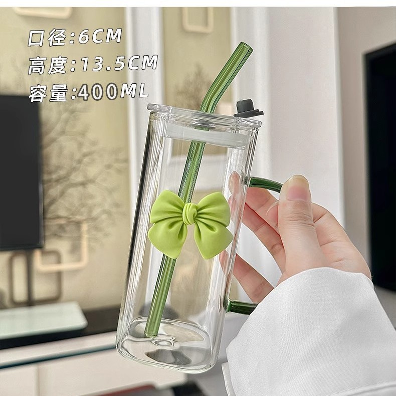 Green transparent straw with bow, glass cover