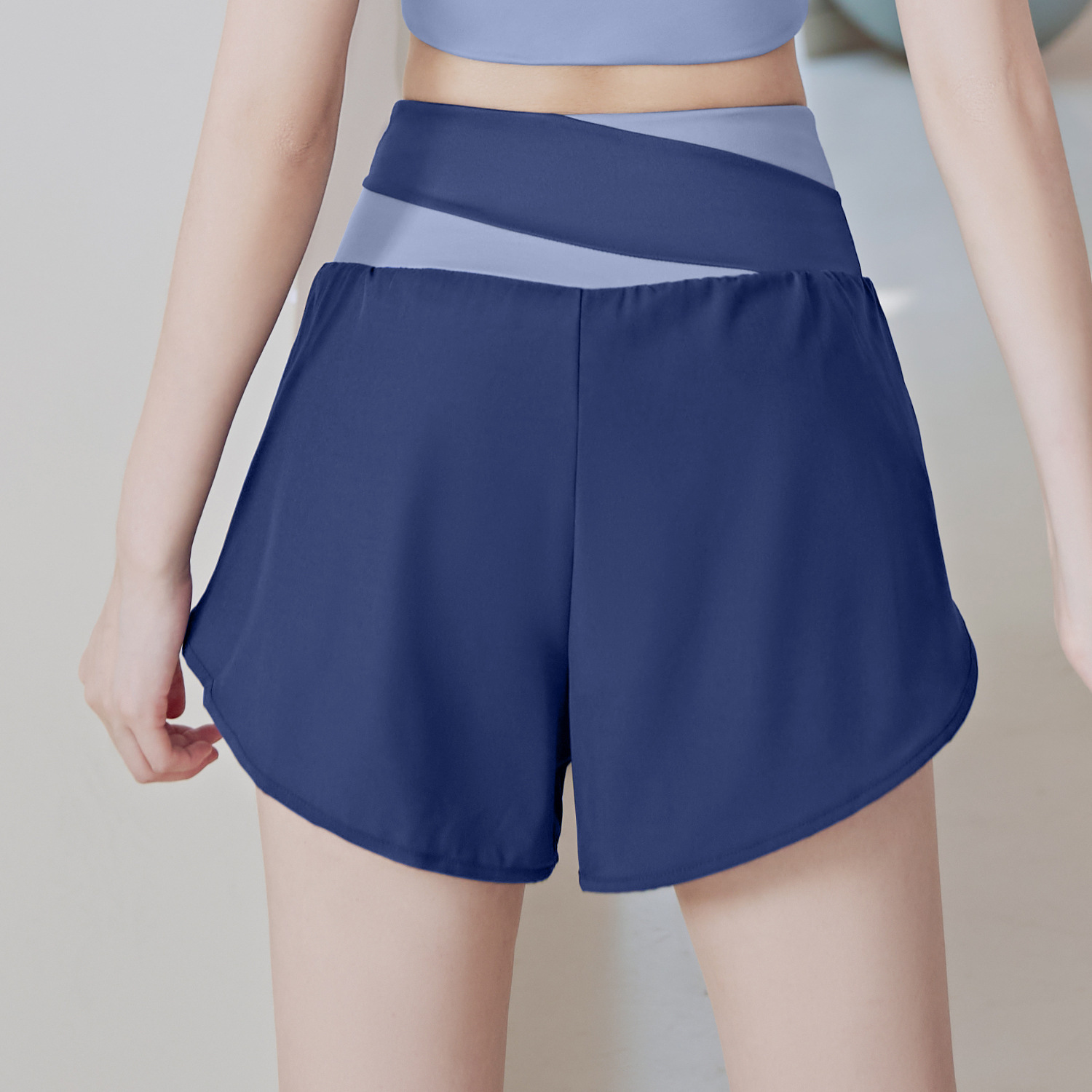 Personalizado Juyitang procesamiento de dos piezas de pantalones cortos de yoga falsos a juego de colores pantalones cortos deportivos antideslumbrantes pantalones deportivos para correr