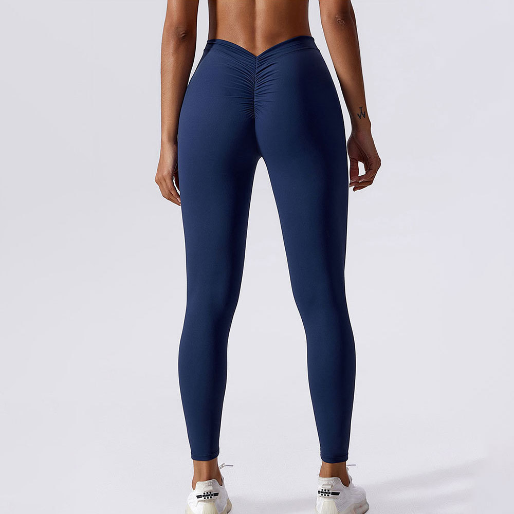 Nuevos productos personalizados de color sólido de la cintura trasera en V arrugada de caderas desnudas de nueve pantalones de alta elasticidad de pantalones de acondicionamiento físico para mujeres