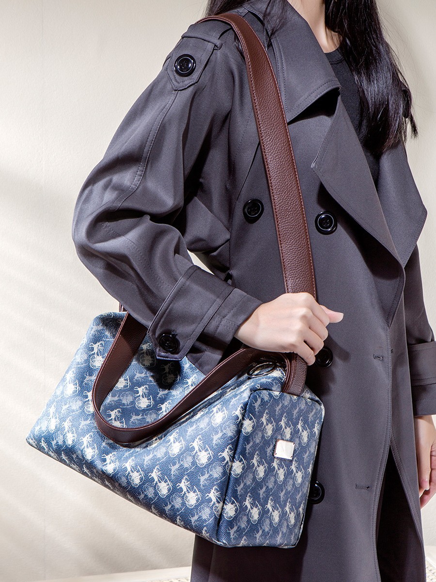 Bolsa impresa de gran capacidad para mujeres 2025 invierno nuevo nicho de textura de alta calidad para viajar mochila de hombro