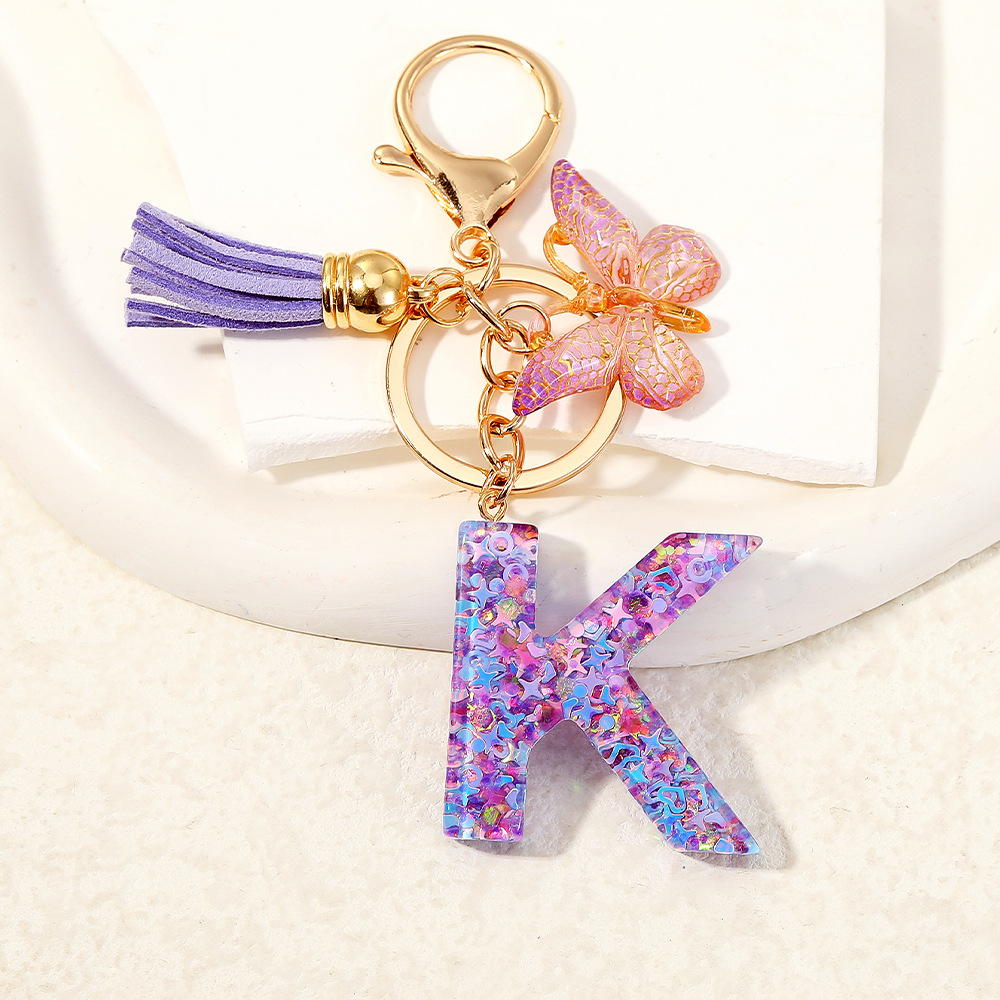 Mayorista transfronterizo mariposa esquinilla iniciales llavero de cristal goteo llavero de letras bolsos colgante