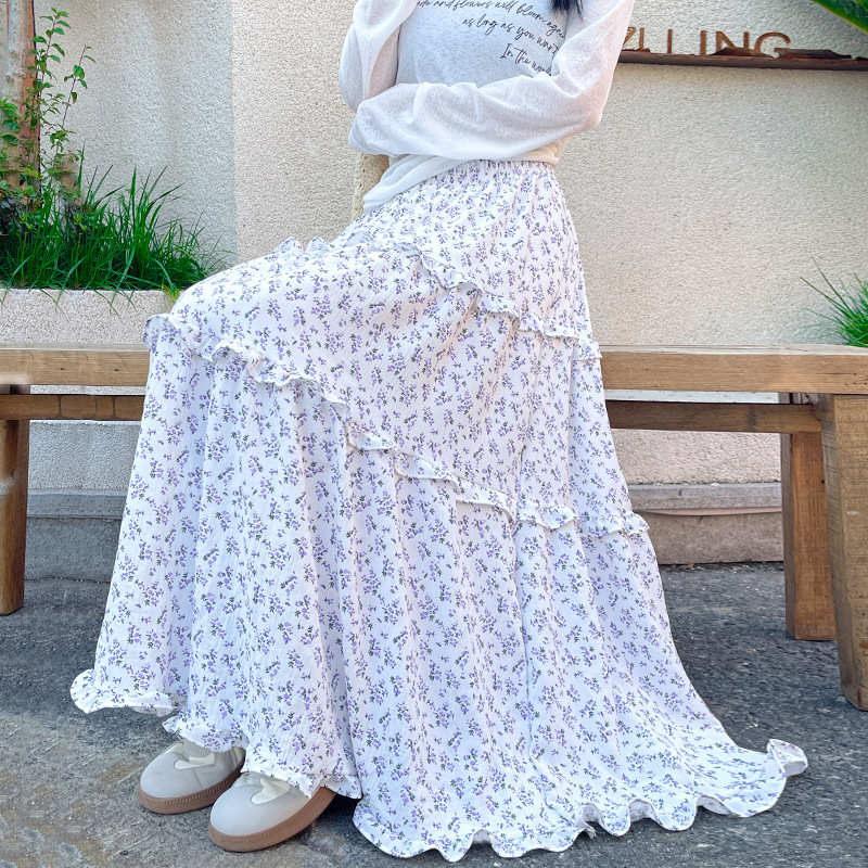 韓国式のレトロな青い花の半身のスカートの女性の春2025新型の高腰のa字のスカートのカジュアルな怠惰な長いスカート